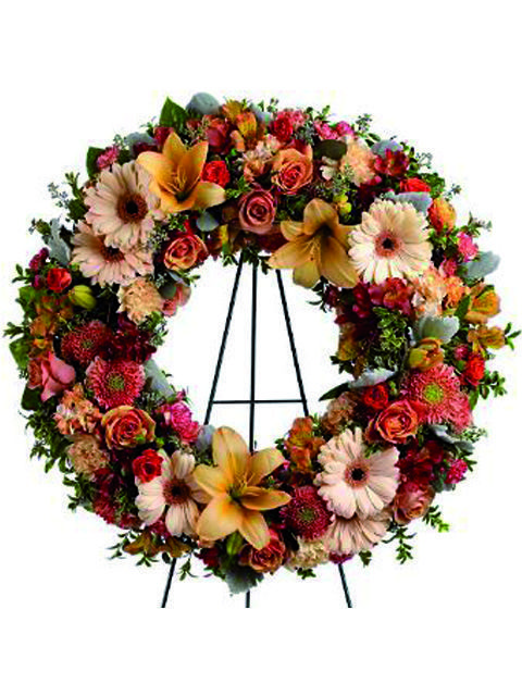 Corona di fiori misti dai colori tenui