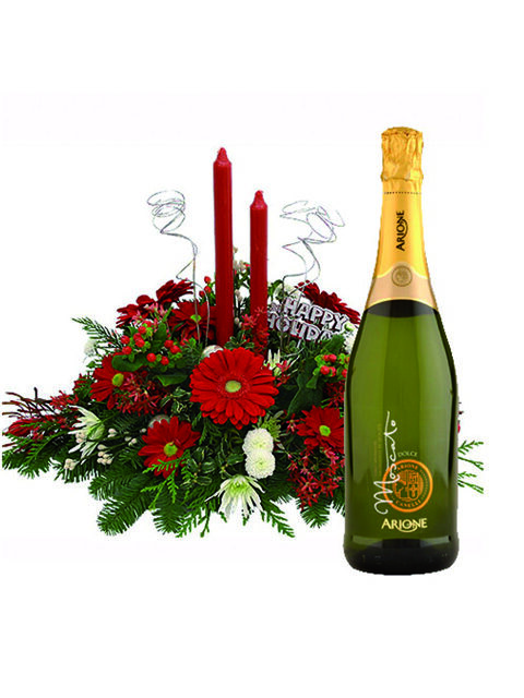 centrotavola con gerbere candele e prosecco