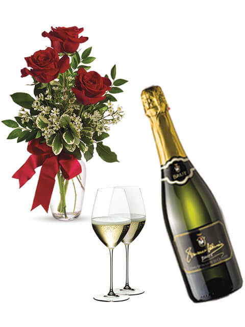 bottiglia di champagne con tre rose rosse
